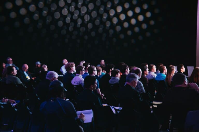Large audience at a business conference — leadership and public speaking